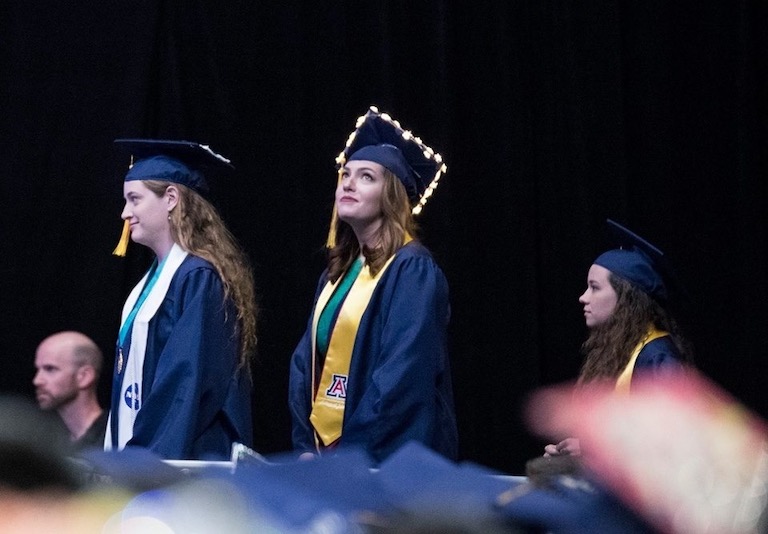 Marina walking across the stage at the University of Arizona 2018 graduation
